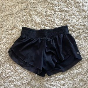 Lululemon black running shorts (lined) with floral trim
